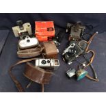 A small collection of cameras to include; a Movikon 8, a colour swinger Polaroid land camera, a