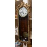 A 19th Century mahogany single weighted 8 day Vienna wall clock with Regency gilt style door Roman