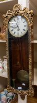 A 19th Century mahogany single weighted 8 day Vienna wall clock with Regency gilt style door Roman