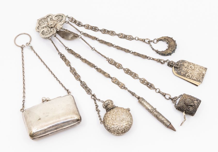 A 19th Century silver plate Chatelaine, the hook applied with Pharaoh's mask, above five chains