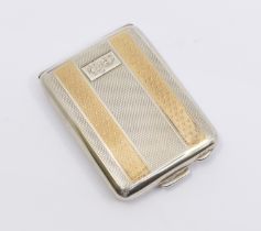 A George V silver and gilt engine turned match box holder, cartouche with monogram, hallmarked F?,