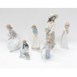 A collection of six Nao figures, two large of young ladies