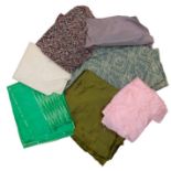 A box containing various remnants of paisley, silks in various colourways and some items of