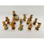 A collection of modern Goebel/MJ Hummel figurines to include; Membership year 2000/2001, 1999/