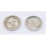 A pair of Victorian Aesthetic silver circular pin trays, lobed sides, with varied floral decoration,