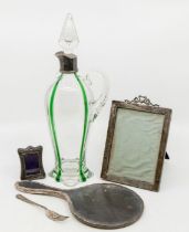 A collection of silver to include: an Art Nouveau silver mounted glass ewer and stopper, with