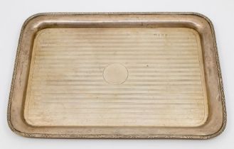 A George V rectangular engine turned silver tray, reeded and leaf border, with central vacant