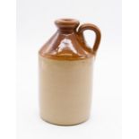 A small salt glazed one handled jug, marked Made in England to base, approx. 18.5cm high.