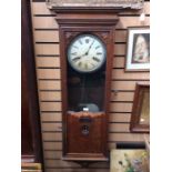 A Bland wall clocking in clock or Industrial Time Recorder. Contained in an oak case. With