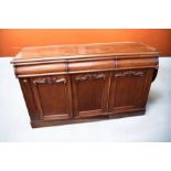 Large Victorian mahogany sideboard with three ornate top drawers, three cupboard doors