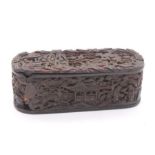 A Chinese carved tortoiseshell snuff box, carved with figures in pagoda and buildings, with trees