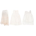 White wear to include: a collection of late Victorian and Edwardian cotton underskirts with lace and