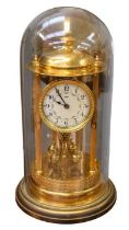 An early 20th century German Kienzle dome anniversary clock, Adams dial with Arabic numeral indices,