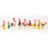 Murano glass. A collection of nine glass cockerel figures in various colours, all with typical red