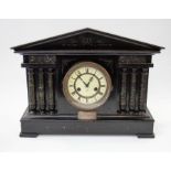 A circa 1900 Roman architectural wooden mantle clock, ebonized, 8 day with Roman numerals