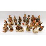 A collection of twenty assorted Hummel figures. Some signs of damage to some.