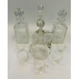 Four mid century 20th century glass decanters along with five punch glasses.