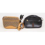 A black Gucci (1980) cross-body leather bag with Gucci tape to the front, front zipped pocket, zip