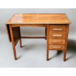 1930s solid oak four-drawer desk with drop-leaf at one end