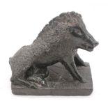 A 20th Century serpentine style green stone carved sitting Boar, rectangular base. Detailed fur,