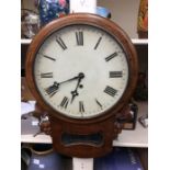 An early 20th Century wall clock, with pendulum