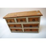 A painted antique pine chest of three above four drawers, 145 x 90 x 48cm, along with a mid 20th