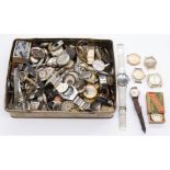 A collection of vintage watch related parts to include ladies and gents watch faces, movements,