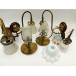 A collection of late 19th/early 20th Century wall lights and shades, with original frosted/cloudy