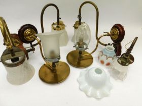 A collection of late 19th/early 20th Century wall lights and shades, with original frosted/cloudy