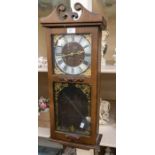 Modern President wall clock contained in a wooden case. Dimensions 28" x 11" x 5" Condition Movement