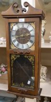Modern President wall clock contained in a wooden case. Dimensions 28" x 11" x 5" Condition Movement