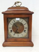 Elliot of London bracket clock with 6" square dial, winged cherub spandrels. A three-train spring