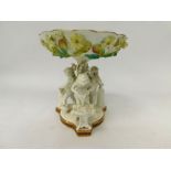 Early 20th C table fruit bowl with three cherubs casting iron swords. Some signs of slight damage.