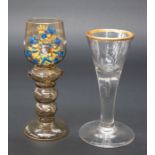 Two 19th Century continental wine and toast glasses, one etched with gilt rim, other with