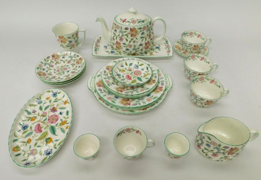 A collection of Minton 'Haddon Hall' items to include: a teapot, 3 tea cups and saucers, one