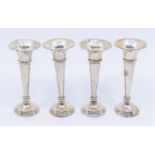 A matched set of four George V silver posy vases, filled, hallmarked Birmingham, various makers,