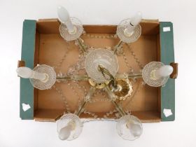 A mid 20th Century six branched ceiling candlelight with glass droplets