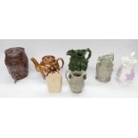 A selection of different stoneware ceramics to include; four relief moulded jugs (all Victorian