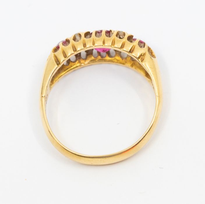 An early 20th century ruby and diamond 18ct gold ring, round mixed cut rubies with small diamond - Image 2 of 2