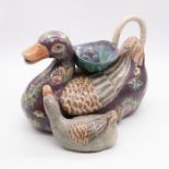 A 20th century decorative pottery duck with duckling at it's side shaped tea pot, with stopper and