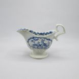 A Liverpool Penningtons porcelain  blue and white relief moulded sauce boat painted with stags in