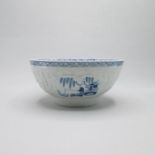 A Liverpool Philip Christians relief moulded blue and white slop bowl, painted with blue oriental