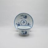 A Liverpool Philip Christians Relief moulded blue and white tea bowl and saucer, painted with blue