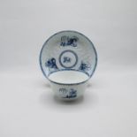 A Liverpool Philip Christians relief moulded blue and white tea bowl and saucer, painted with blue