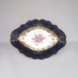 A Worcester Dr Wall period Oval dish, cobalt blue and gilt ground deep border, the centre painted