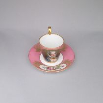 A French porcelain cup and saucer , Pink ground , painted with a portrait of a young lady, with