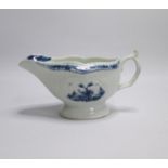 A Worcester Blue and White Sauce boat of pleated and moulded form, painted with two Chinese