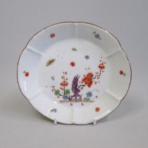 A Meissen yellow ground lobed dish, painted with insects and flowers, blue crossed swords mark,