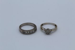 Two 18ct gold and diamond rings, one a flower shaped cluster with seven round brilliant cut