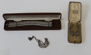 A collection of Edwardian jewellery in white metal/ silver and paste